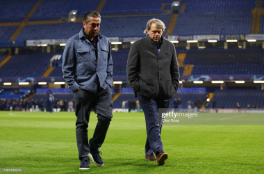 Behdad Eghbali and Todd Boehly walk cross the Stamford Bridge pitch (Photo by Clive Rose/Getty Images)