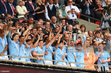 Manchester City lift the FA Cup trophy (Photo by Shaun Botterill/Getty Images)