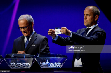 Joe Coles displays Arsenal after drawing them into group 'B' (Photo by Valerio Pennicino - UEFA/UEFA via Getty Images)