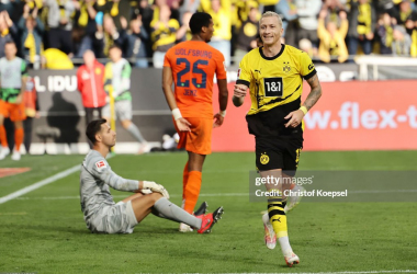 Marco Reus celebrates his winning goal in Borussia Dortmund's 1-0 win over VfL Wolfsburg.&nbsp;<span style="color: rgb(8, 8, 8); font-family: Lato, sans-serif; font-size: 14px; font-style: normal; text-align: start; background-color: rgb(255, 255, 255);">(Photo by Christof Koepsel/Getty Images)</span>