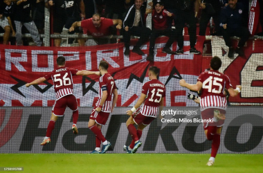 A group of Olympiacos players celebrate their opening goal against West Ham (Photo by Milos Bicanski/Getty Images)
