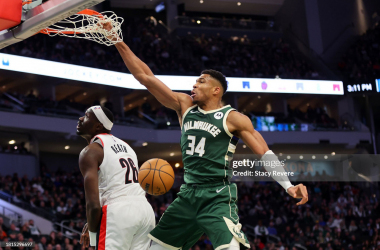 Giannis Antetokounmpo throws it down over the defender (Photo by Stacy Revere/Getty Images)