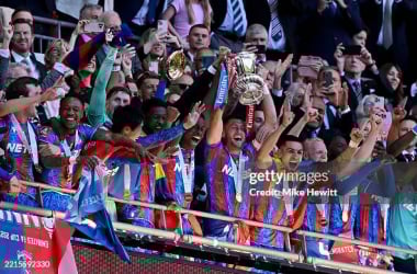Crystal Palace v Manchester City - Emirates FA Cup FinalLONDON, ENGLAND - MAY 17: Marc Guehi and Joel Ward of Crystal Palace lift the FA Cup trophy after their team's victory in the Emirates FA Cup Final match between Crystal Palace and Manchester City at Wembley Stadium on May 17, 2025 in London, England. (Photo by Mike Hewitt/Getty Images)