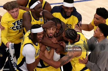   Tyrese Haliburton #0 The Indiana Pacers is congratulated by his teammates after he wrapped a playful basket against the New York Knicks in the fourth quarter of the NBA Playoffs in New York City in the fourth quarter. (Photo by Al Bello/Getty Images)