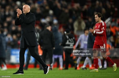 Arne Slot salutes the supporters at full time. (Photo by Paul ELLIS / AFP via Getty Images)