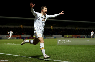 BURTON-UPON-TRENT, ENGLAND - DECEMBER 04: Dennis Politic of Port Vale celebrates after scoring their sides second goal during the Emirates FA Cup Second Round match between Burton Albion and Port Vale at Pirelli Stadium on December 04, 2021 in Burton-upon-Trent, England. (Photo by Charlotte Tattersall/Getty Images)
