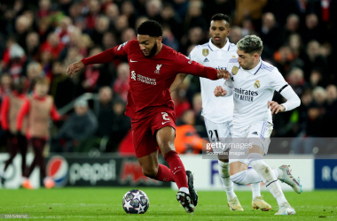 (L-R) Liverpool's Joe Gomez, Real Madrid's Rodrygo Silva de Goes and Fede Valverde during the UEFA Champions League match between Liverpool v Real Madrid on February 21, 2023 at Anfield. (Photo by David S. Bustamante/Soccrates/Getty Images)