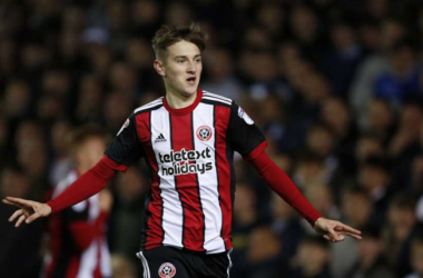 Leeds United 1-2 Sheffield United: Brooks&#039; first senior goal sends Blades top of the league