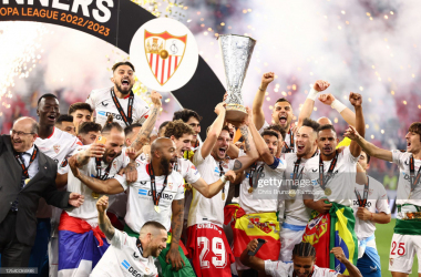 Ivan Rakitic of Sevilla FC lifts the trophy with his team-mates following their victory in a penalty shootout at the end of the UEFA Europa League 2022/23 final match between Sevilla FC and AS Roma at Puskas Arena on May 31, 2023 in Budapest, Hungary. (Photo by Chris Brunskill/Fantasista/Getty Images)