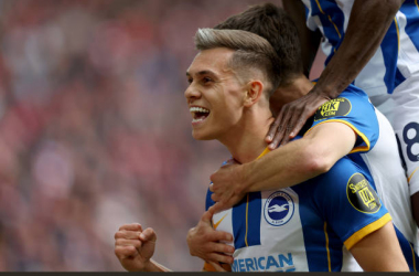 Trossard celebrates with Brighton fans at Anfield [Getty Images]