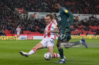 <span style="color: rgb(8, 8, 8); font-family: Lato, sans-serif; font-size: 14px; font-style: normal; text-align: start; background-color: rgb(255, 255, 255);">Middlesbrough's Marc Bola competing with Stoke City's Ben Wilmot during the Sky Bet Championship match between Stoke City and Middlesbrough at Bet365 Stadium on December 11, 2021 in Stoke on Trent, England. (Photo by Andrew Kearns - CameraSport via Getty Images)</span>
