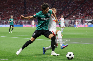 <div style="text-align: start;">Hiroki Ito and Xavi Simons battling for the ball (Photo by Boris Streubel/Getty Images&nbsp;</div>