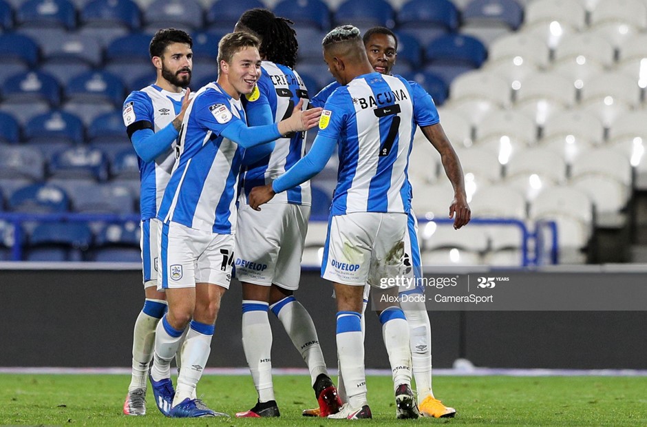 Millwall 0-3 Huddersfield Town: Terriers maul Lions in late showing