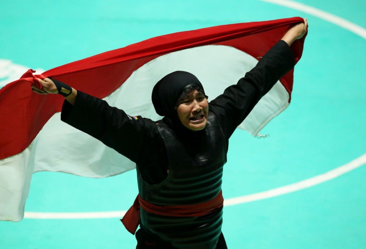 Atlet Pencak Silat Pipiet Kamelia Meraih Medali Emas  Untuk Indonesia