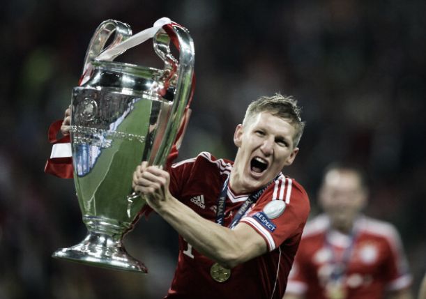 Bastian Schweinsteiger of Germany lifts the World Cup trophy with